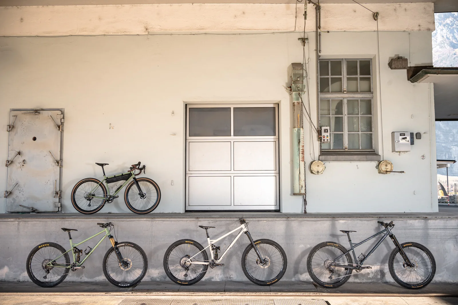 Four RAIL bicycles in front of an old loading platform